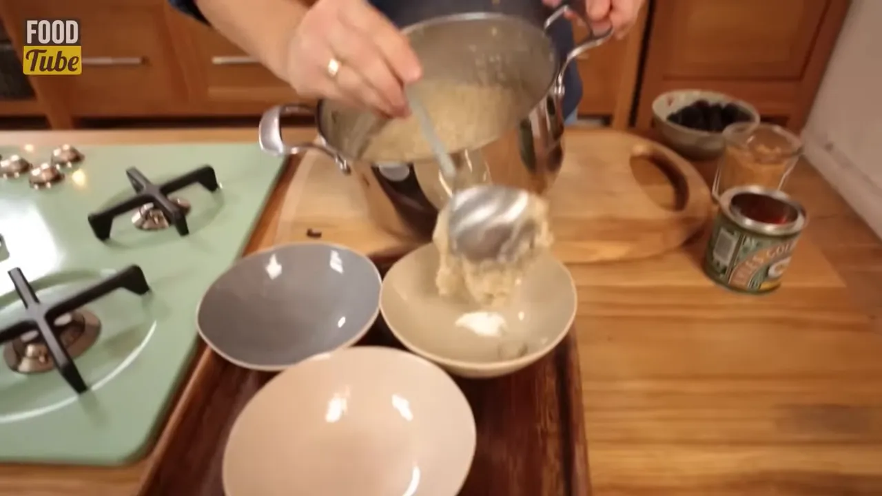 Thick porridge being portioned into bowls