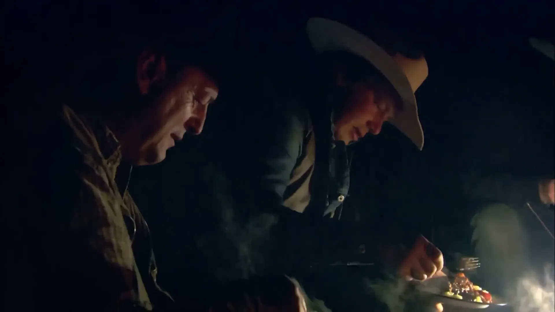 Dutch oven cooking cowboy meal over the fire