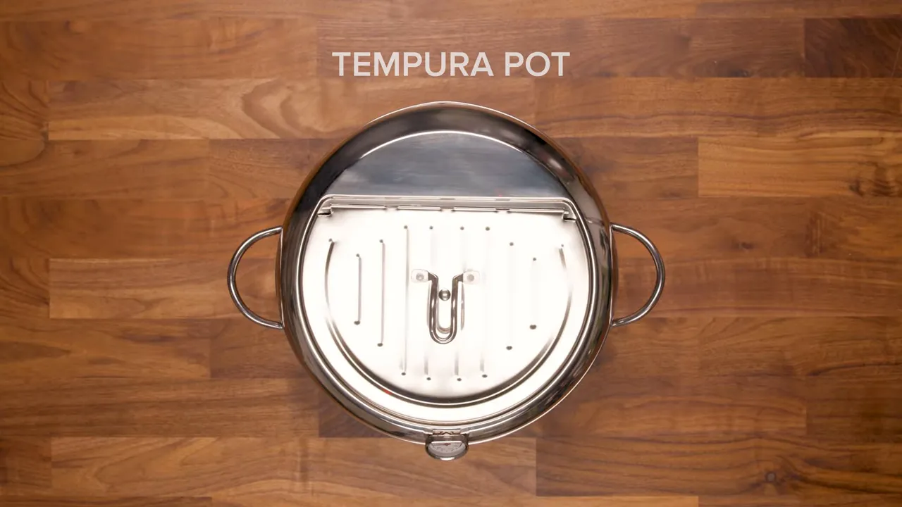overhead view of a stainless 'TEMPURA POT' with rack, shown on a wooden counter
