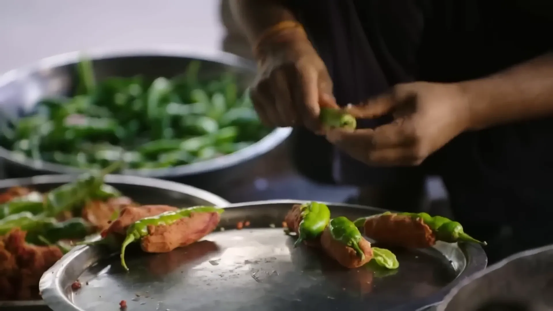 Green chilies stuffed with spiced potato and fried in chickpea batter