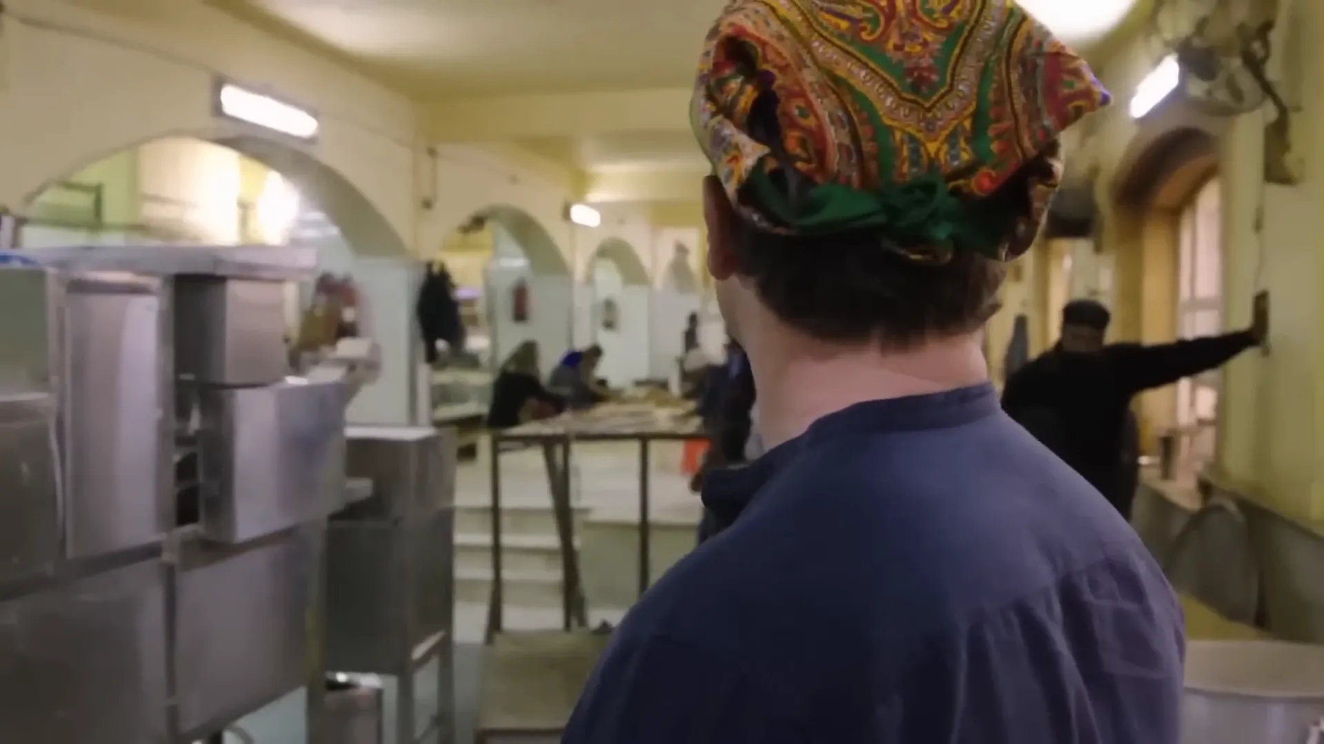 Volunteers preparing chapatis in the Sikh temple kitchen