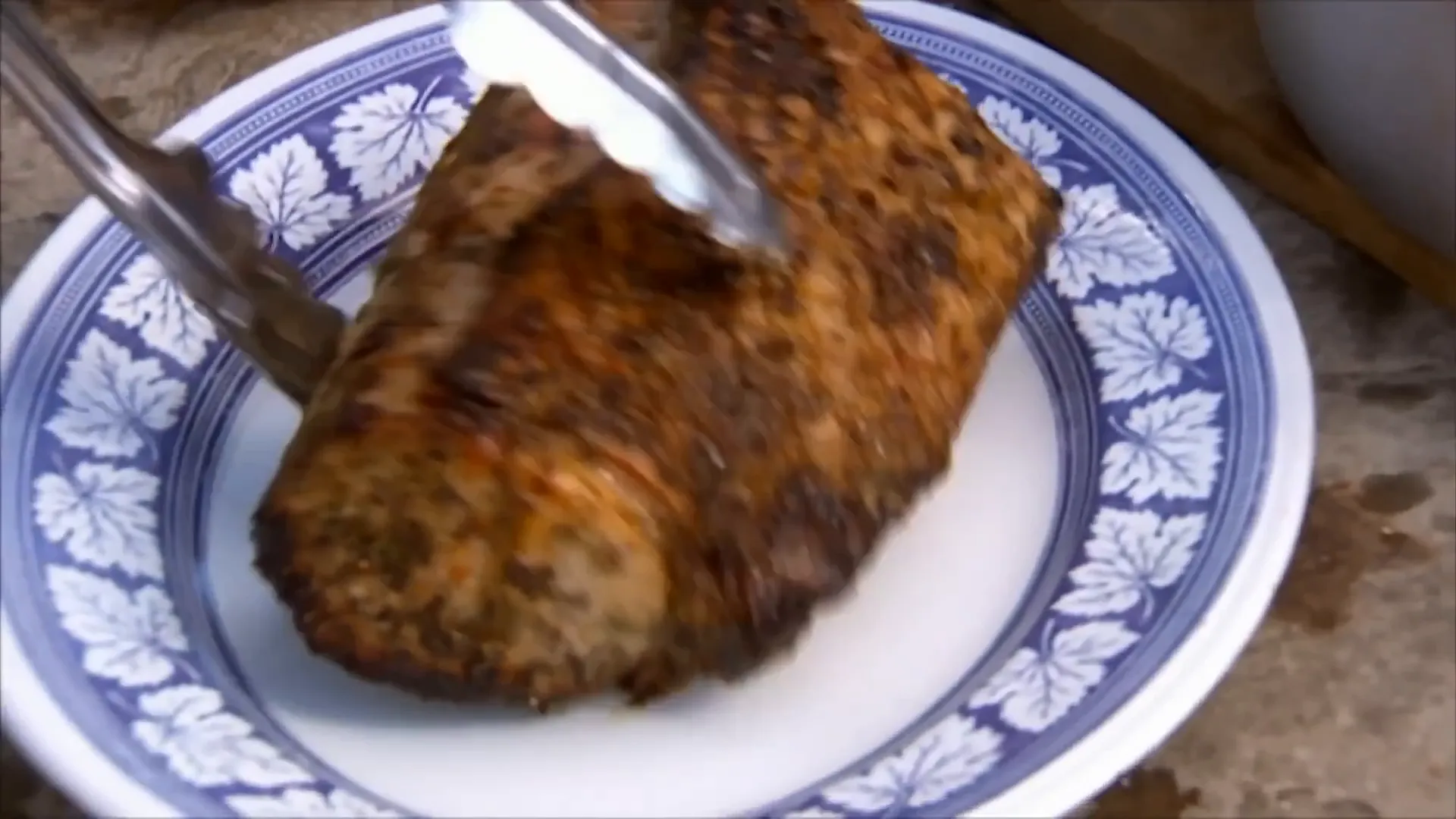 Resting roasted pork loin on a platter