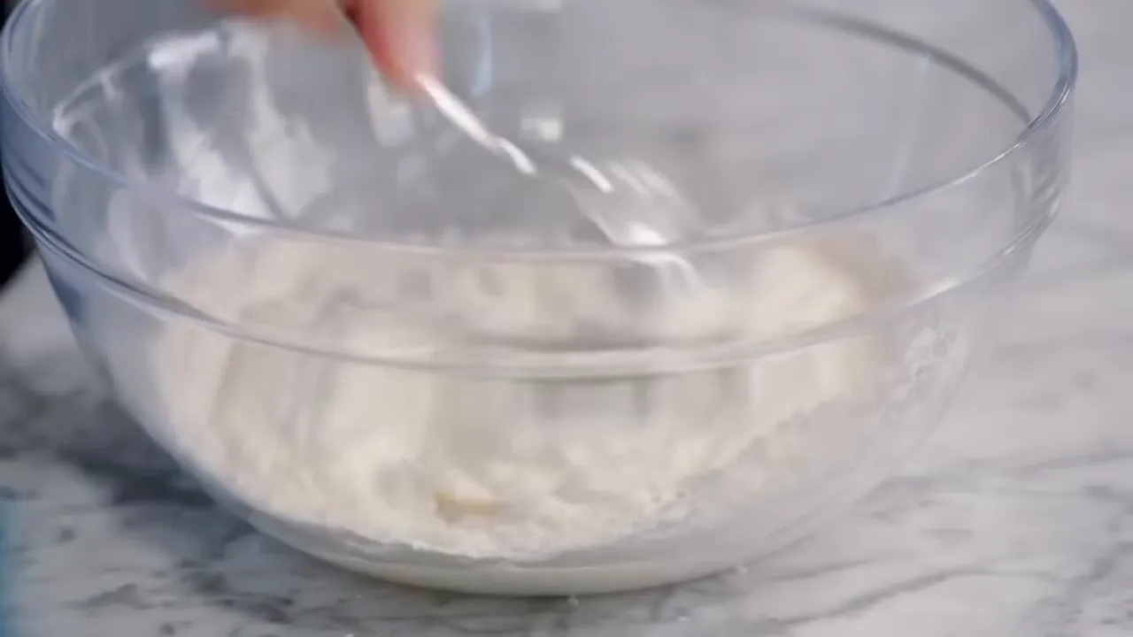 bowl with yogurt, flour and honey being added