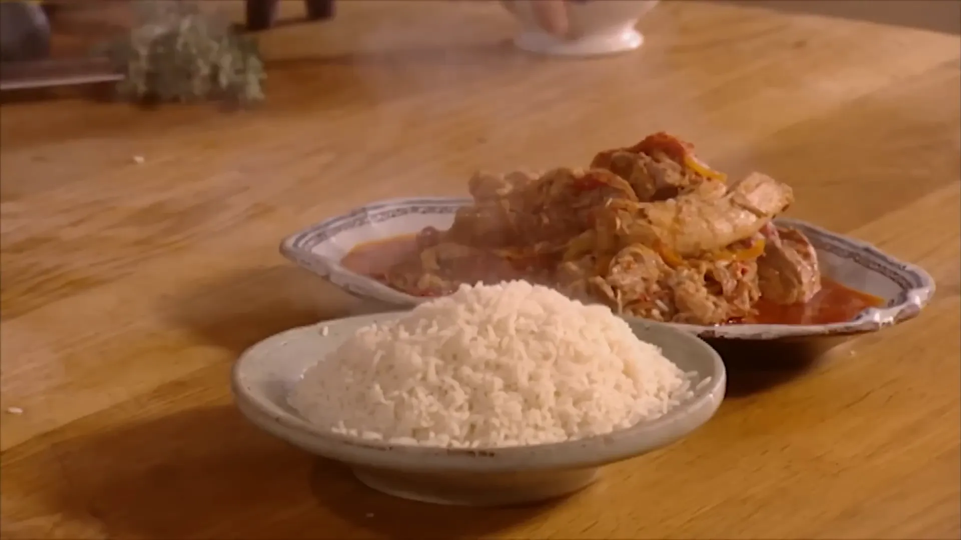 Slow-cooked spicy pork shoulder with peppers and rice