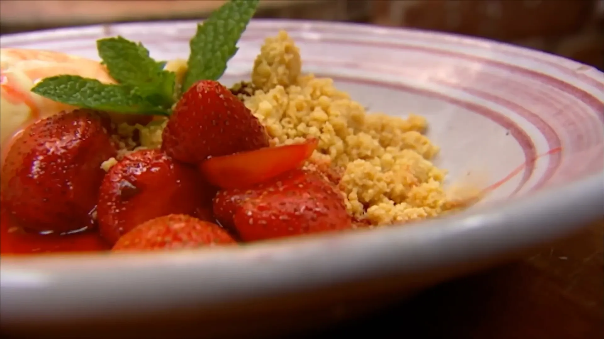 Grilled strawberries with vanilla, ginger syrup, and shortbread crumbs