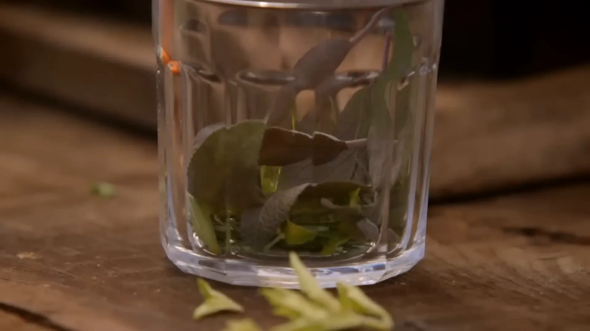 Jar of duck fat infused with fresh herbs