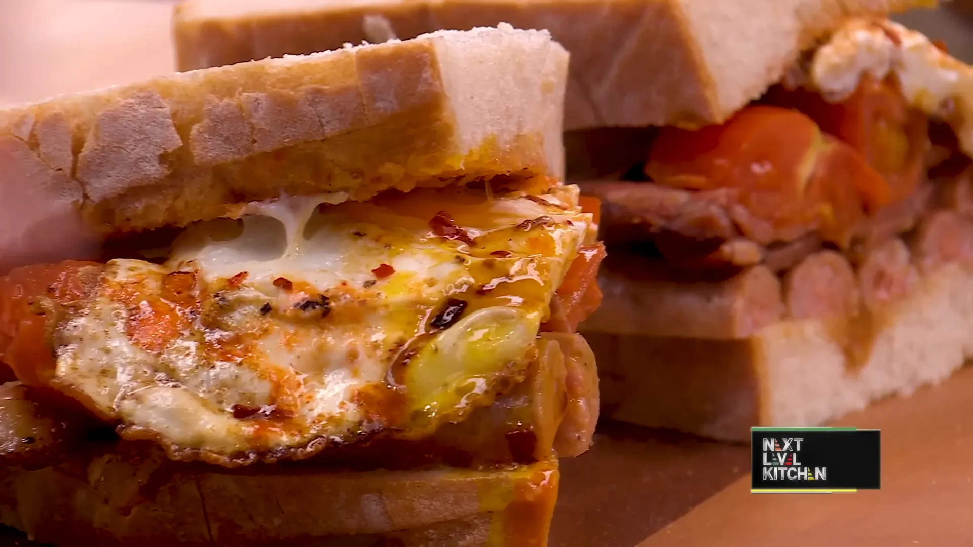 Sliced breakfast sandwich with runny egg