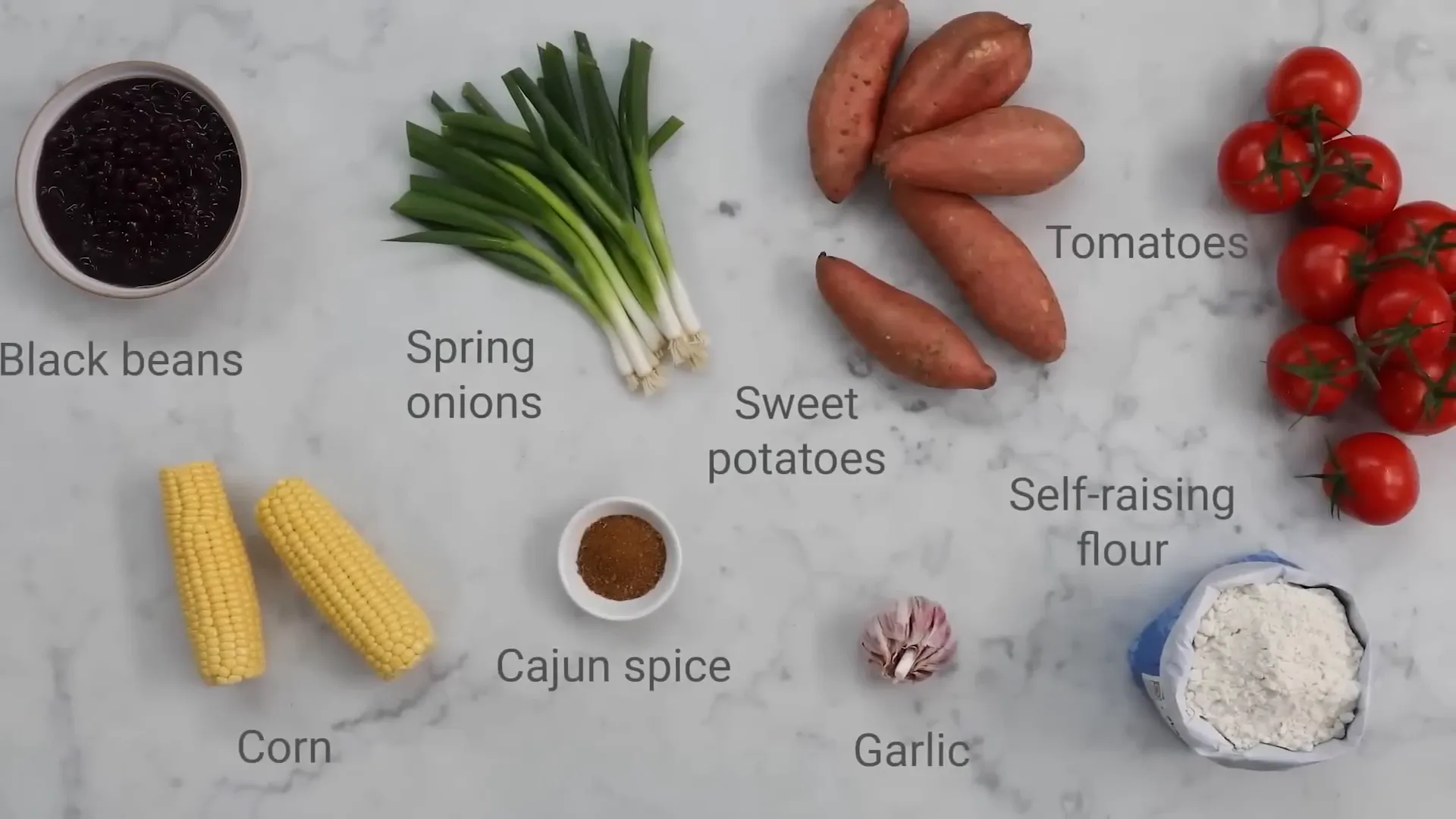 Jamie holding a bowl of smoky veggie chilli ingredients