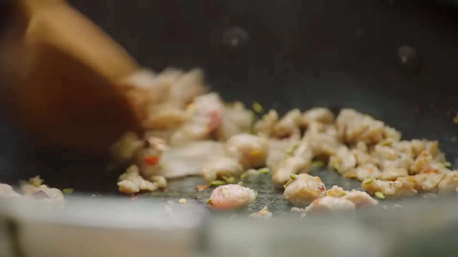 Sausages frying with fennel seeds and chilli flakes