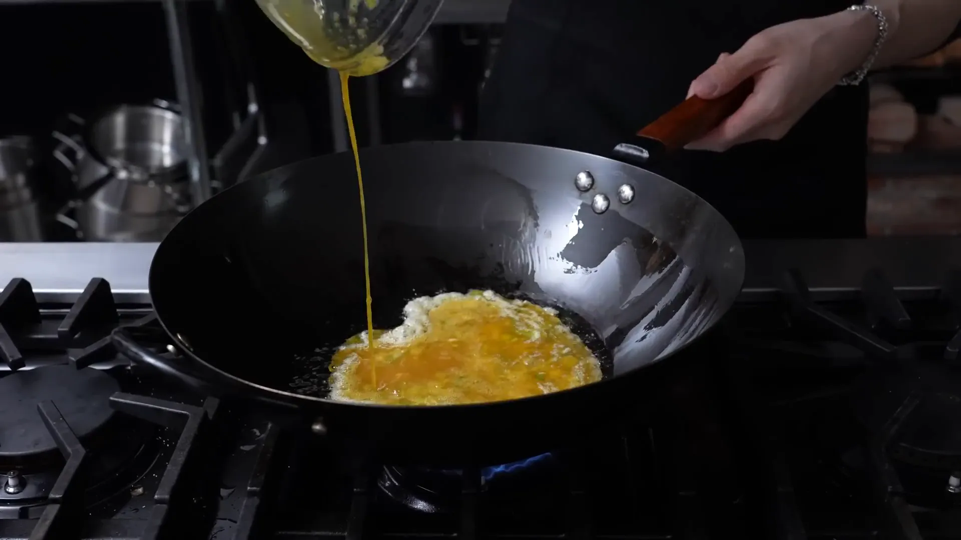 Golden, puffed Thai-style crispy omelet in a wok