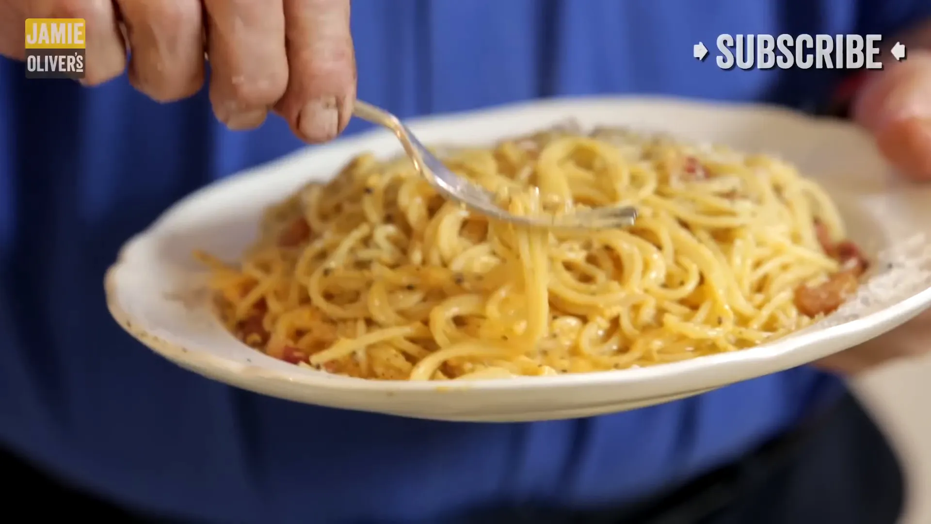 Finished authentic Spaghetti Carbonara with cheese and pepper