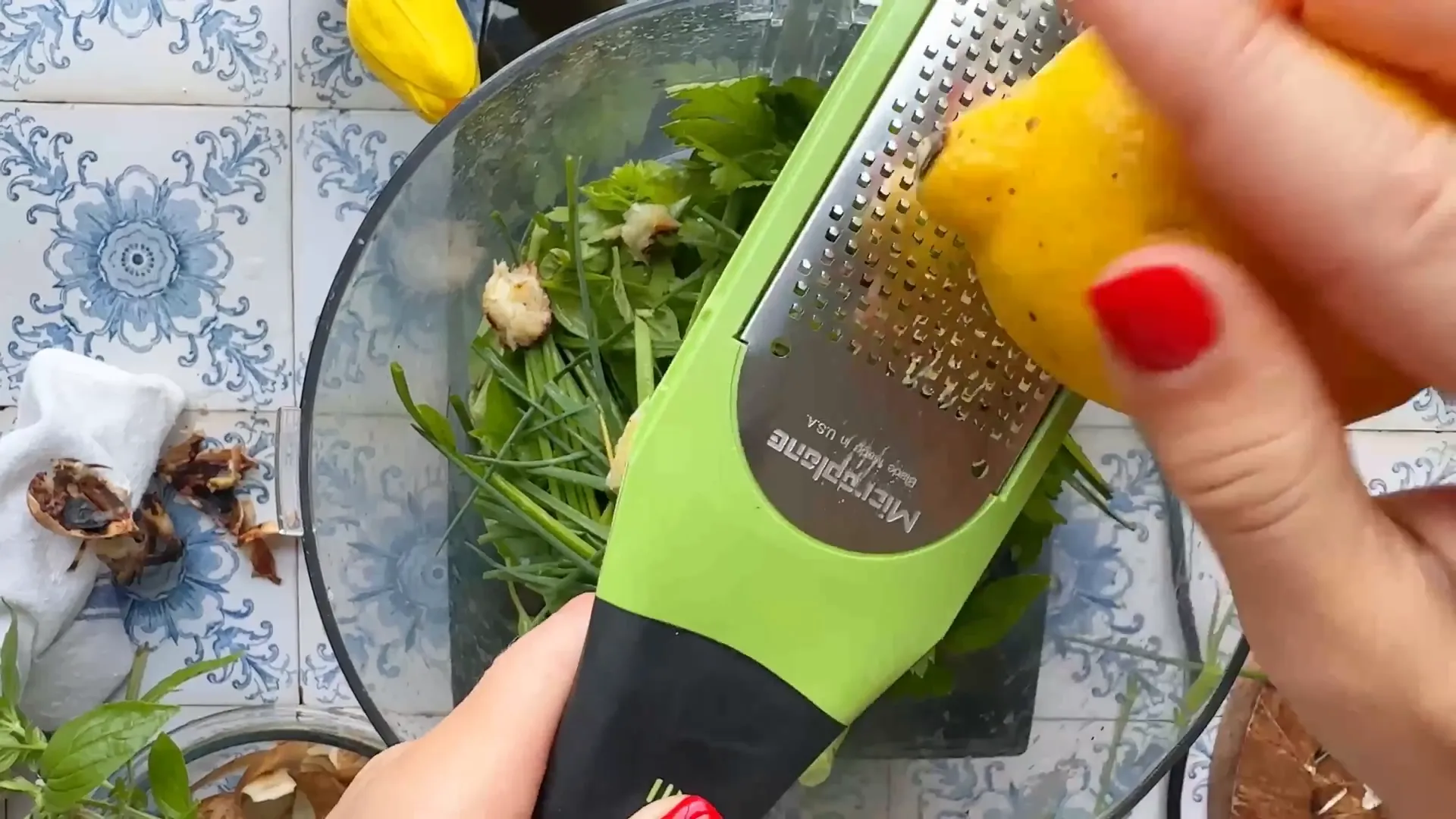 Adding lemon zest and juice to the food processor for dressing