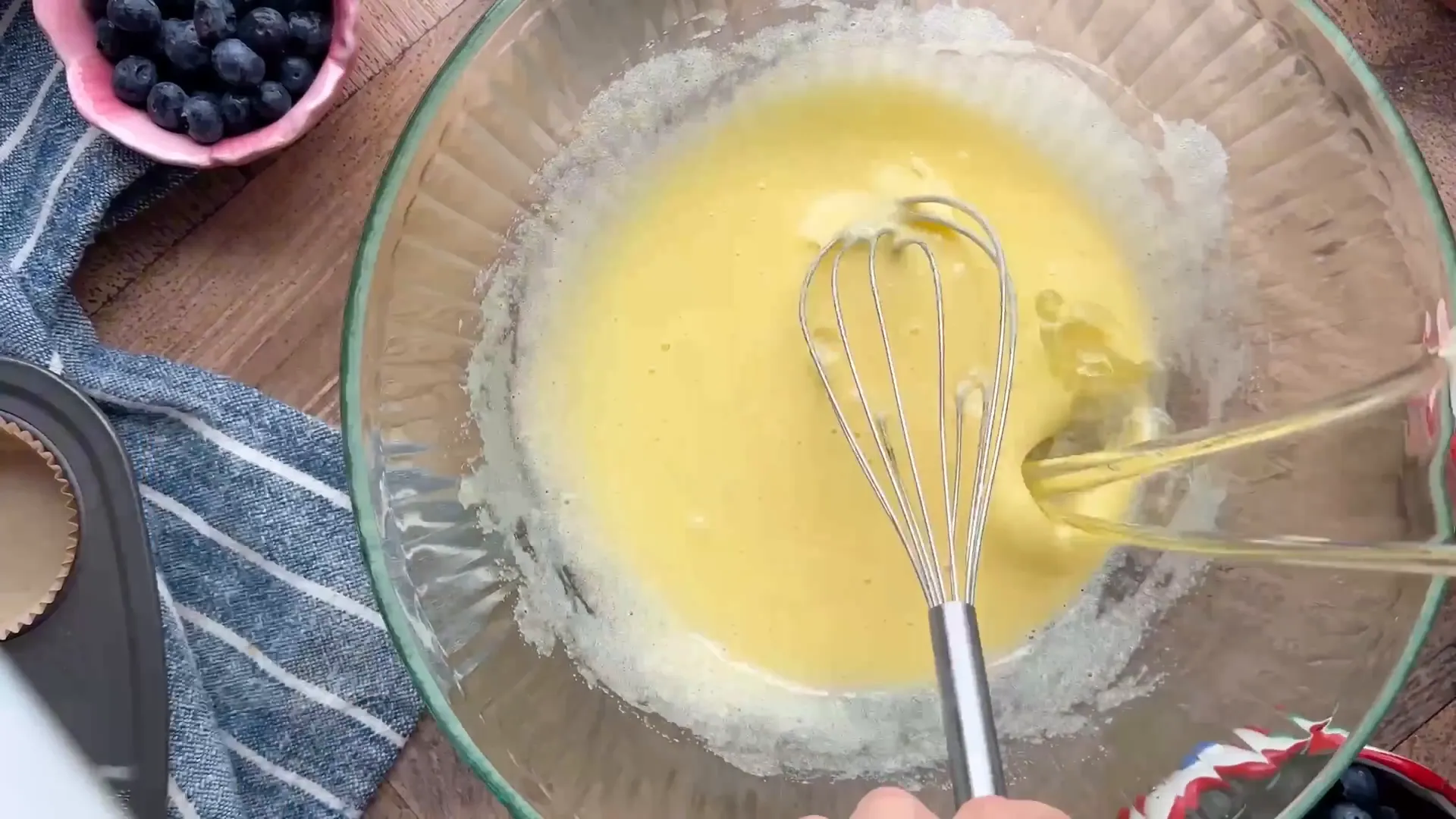 Whisking eggs and sugar until pale and frothy