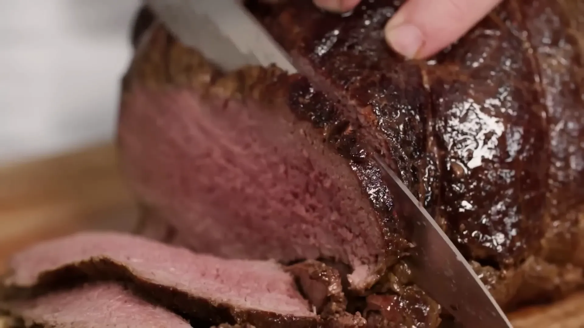 Slicing juicy roast beef thinly