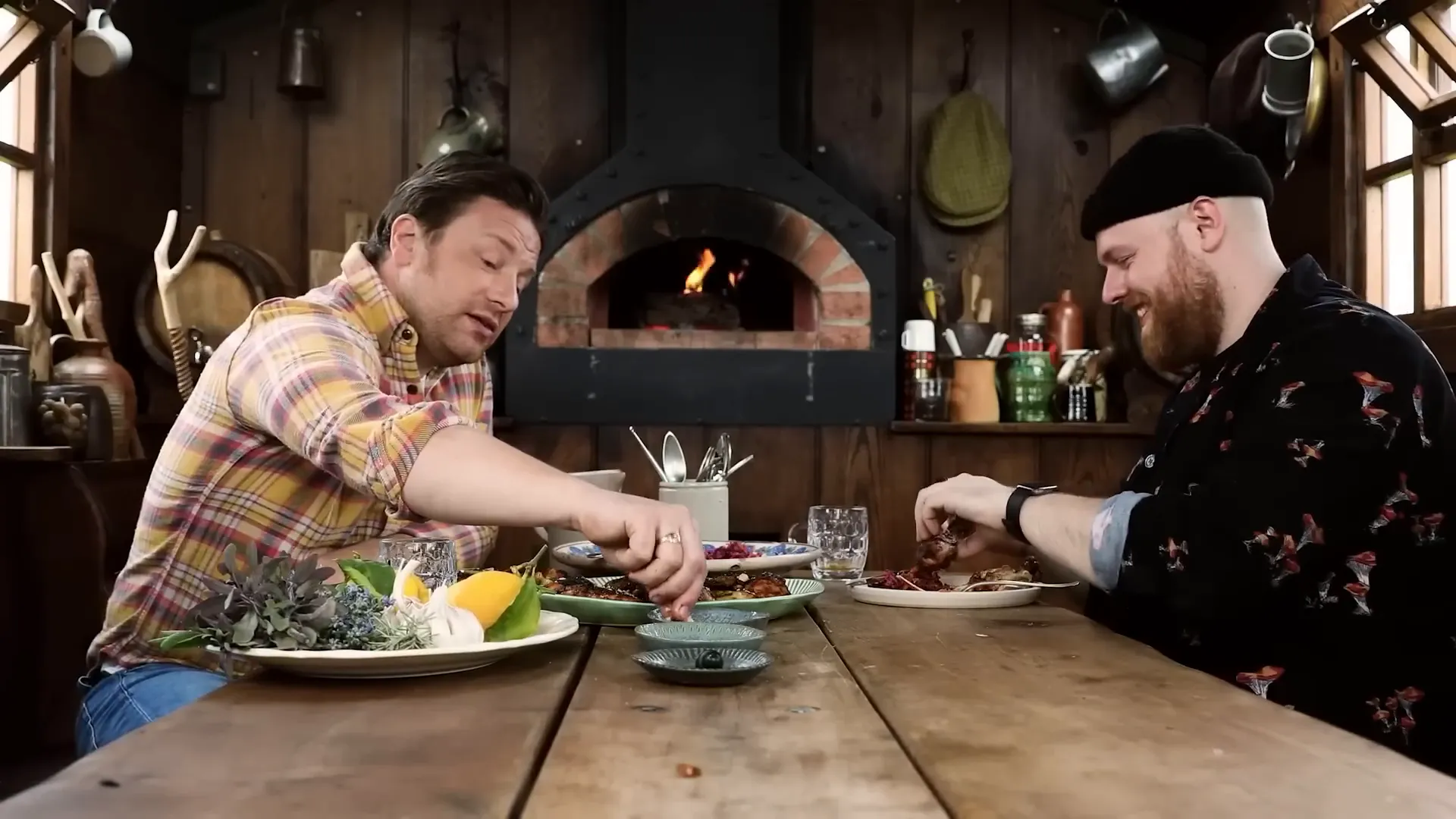 Jamie Oliver and Tom Walker examining the hot sauce bottles