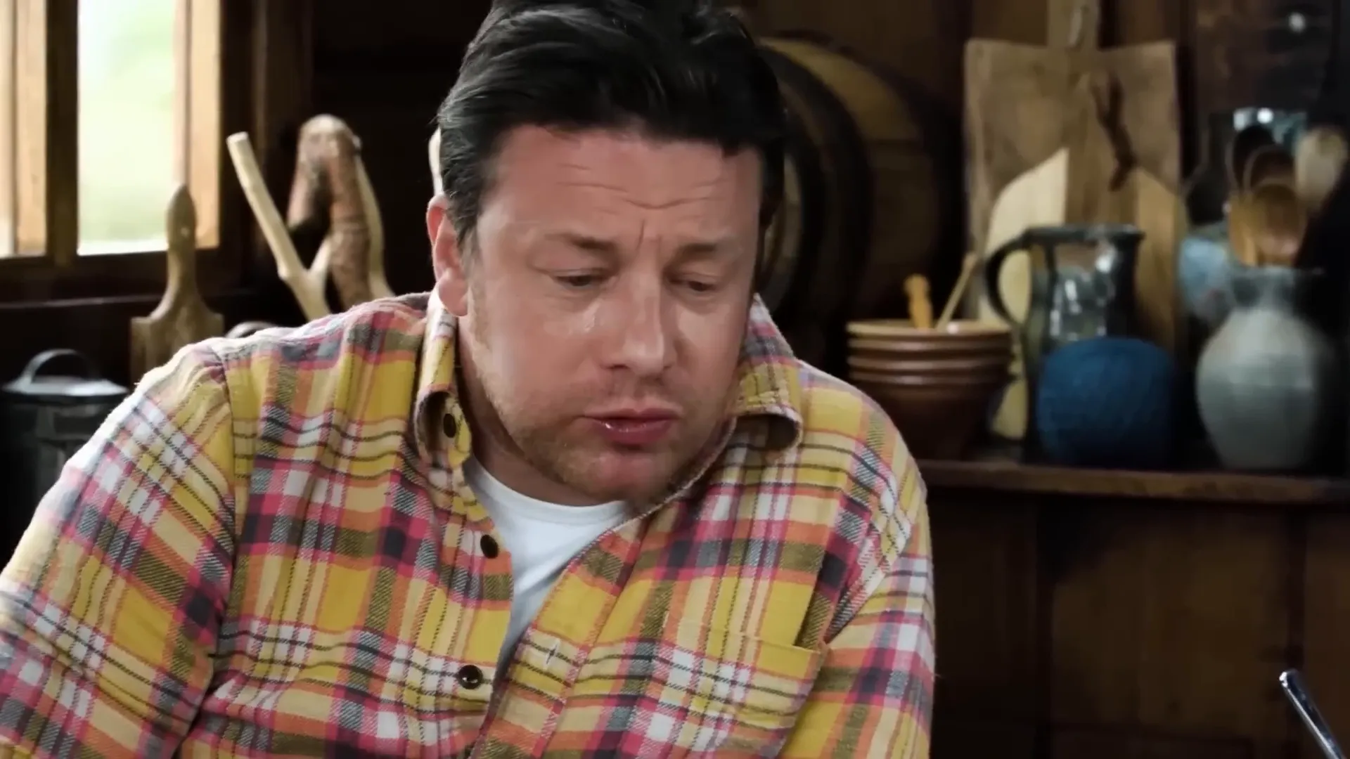 Jamie Oliver sweating and reacting to the Ultra Death hot sauce