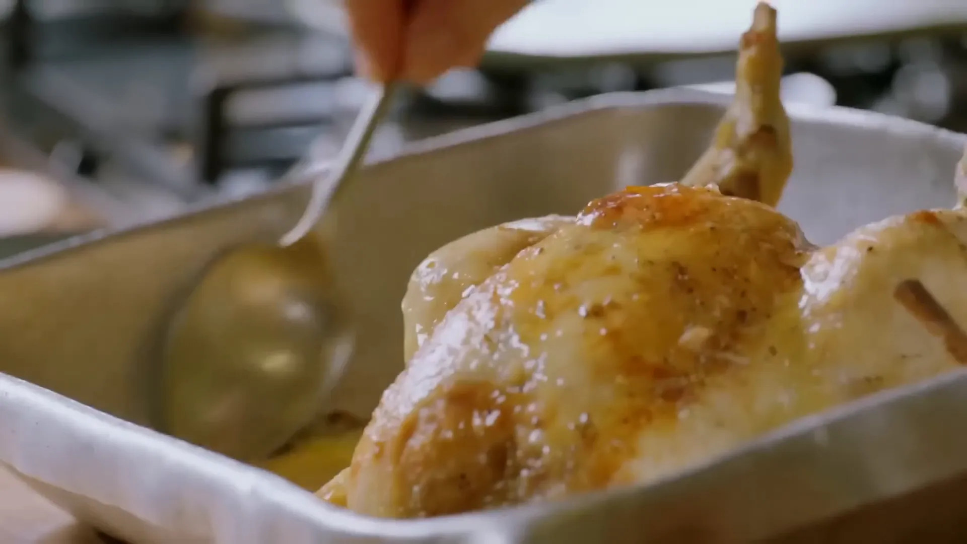 Golden roast chicken and roasted garlic in the tray