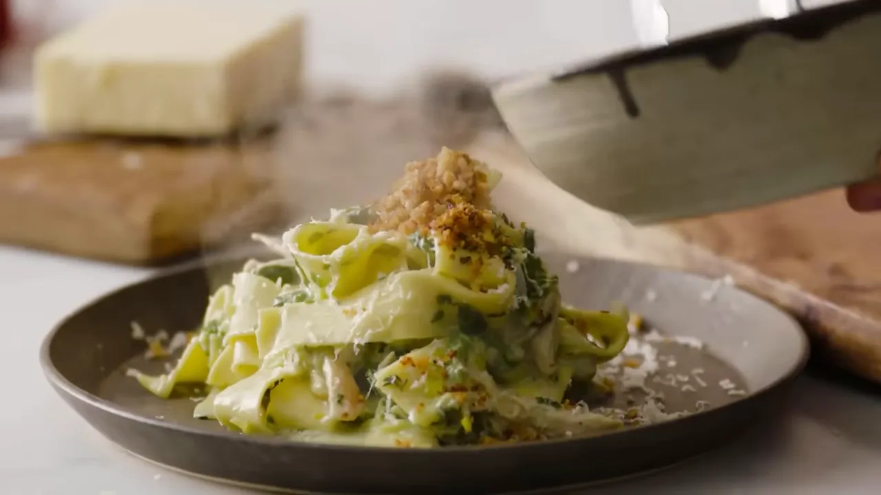 plated one-pan turkey pasta topped with grated cheese and toasted breadcrumb crumble