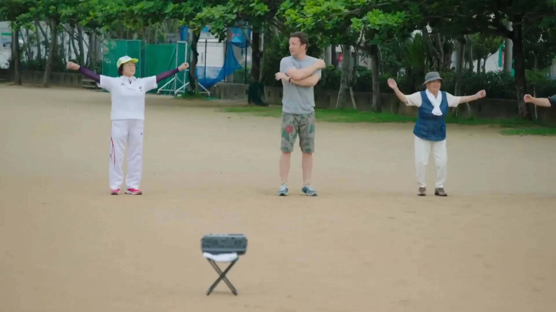 Group of elderly people doing morning radio exercises in Okinawa
