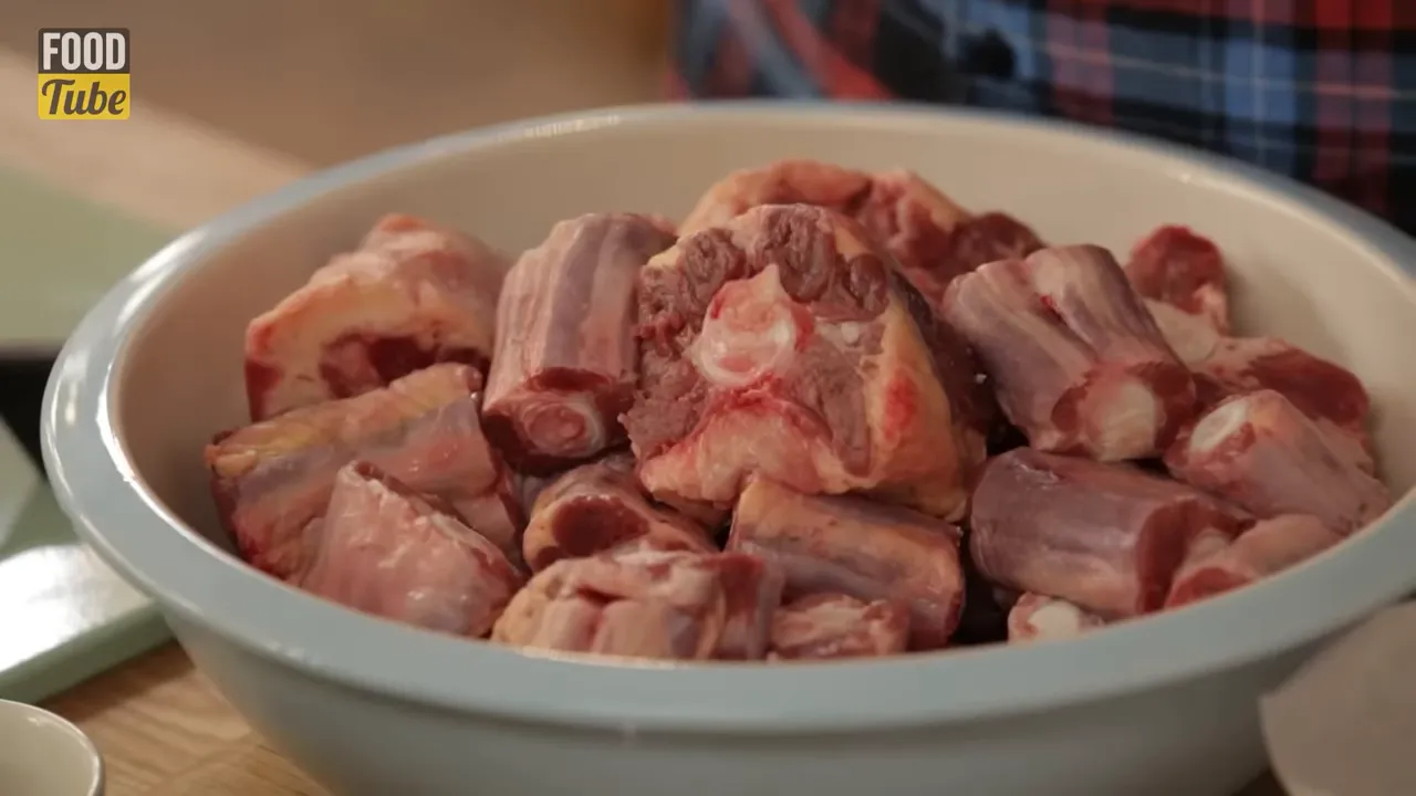 Oxtail roasting on a tray ready to be added to the stew pot