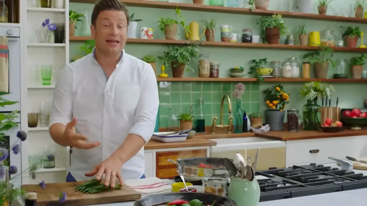 Sliced okra being added to a pan to thicken and enrich the stew
