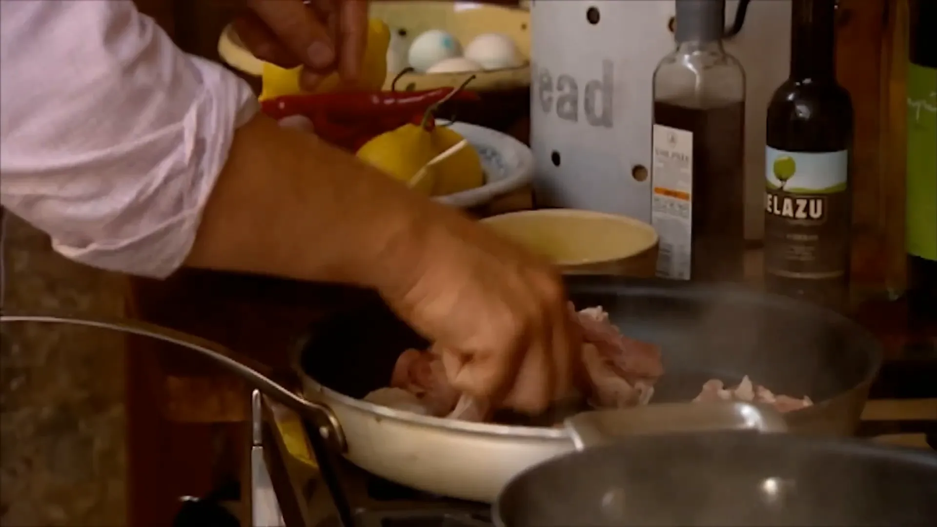 Chicken pieces placed skin side down in a pan to render fat