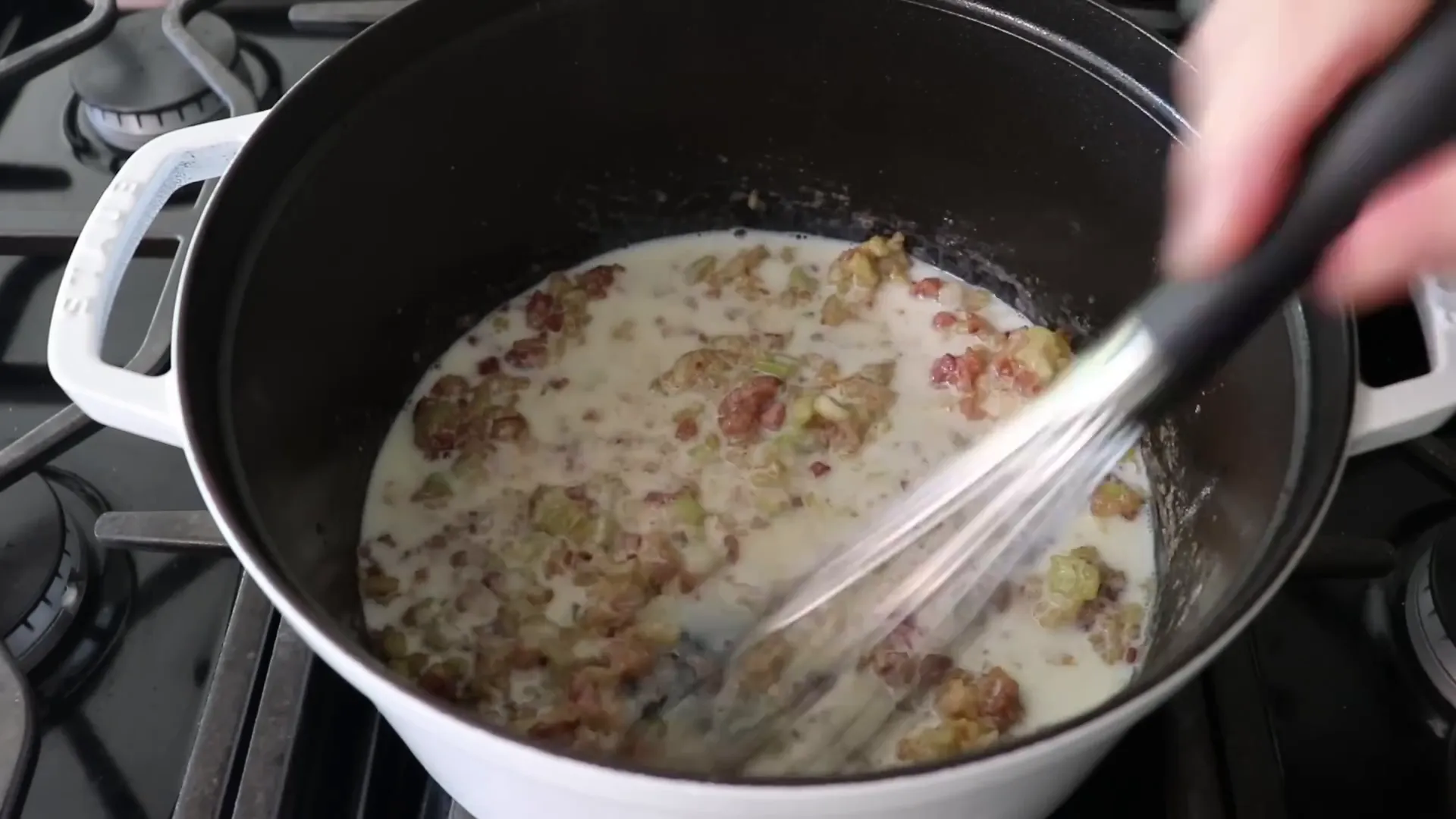 Making a roux with flour and cold milk whisked in
