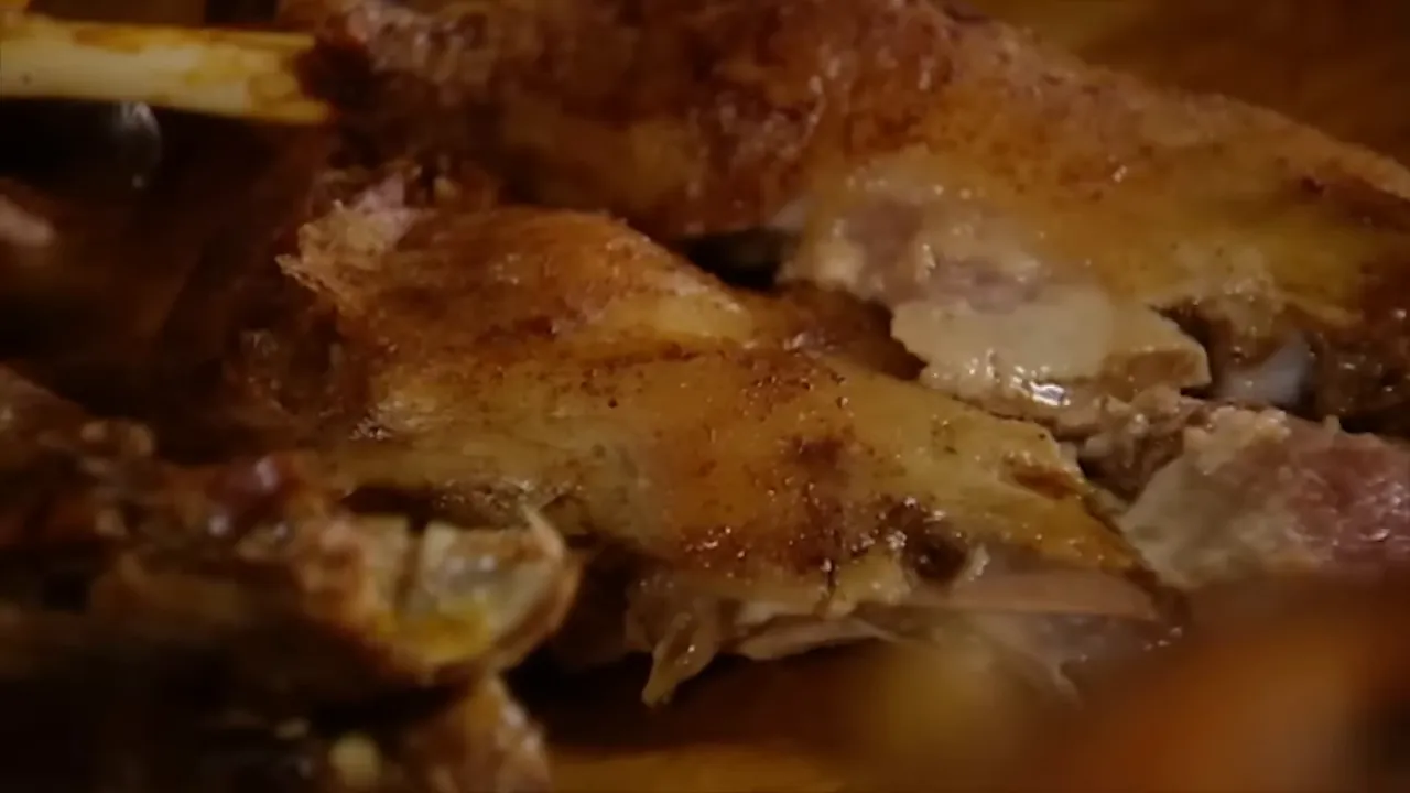 Sliced carved turkey breast and dark meat on a wooden board ready to serve