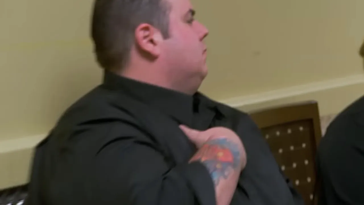 Chef clutching his chest in obvious discomfort during dinner service