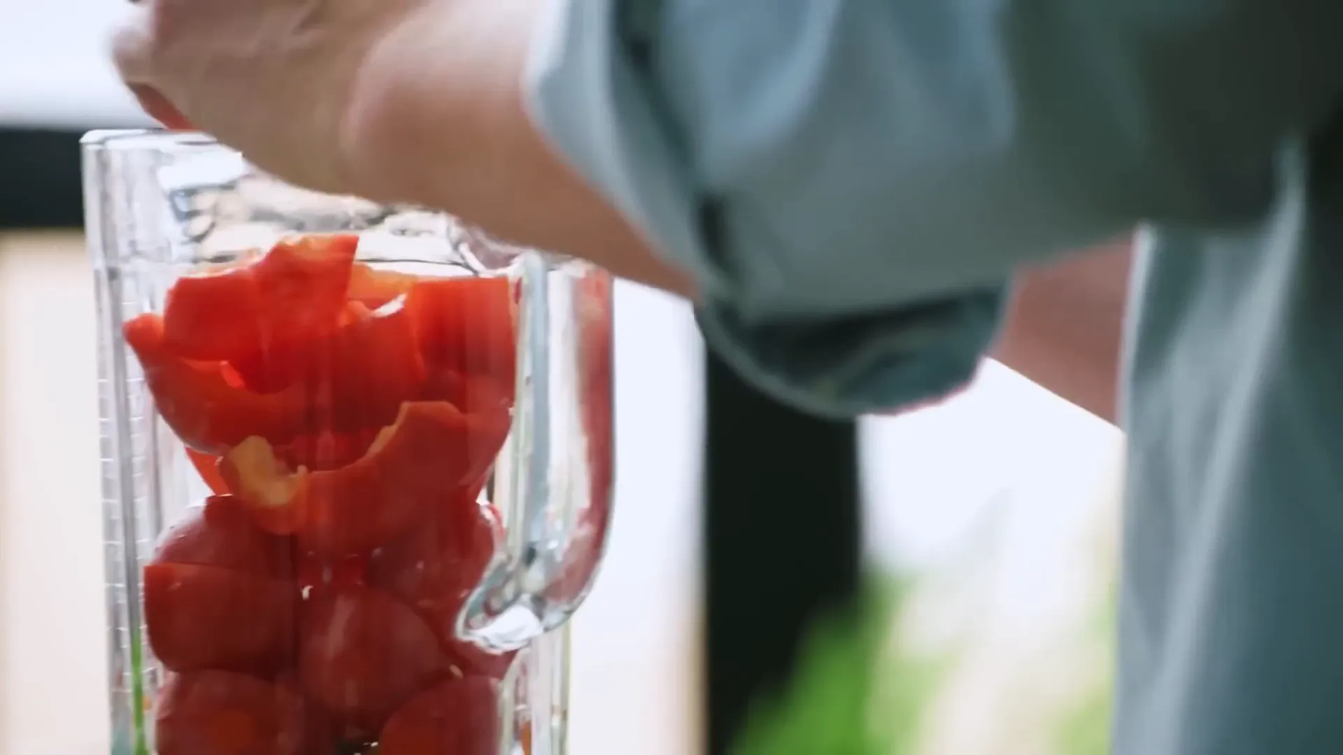 Preparing fresh tomatoes and peppers for the soup