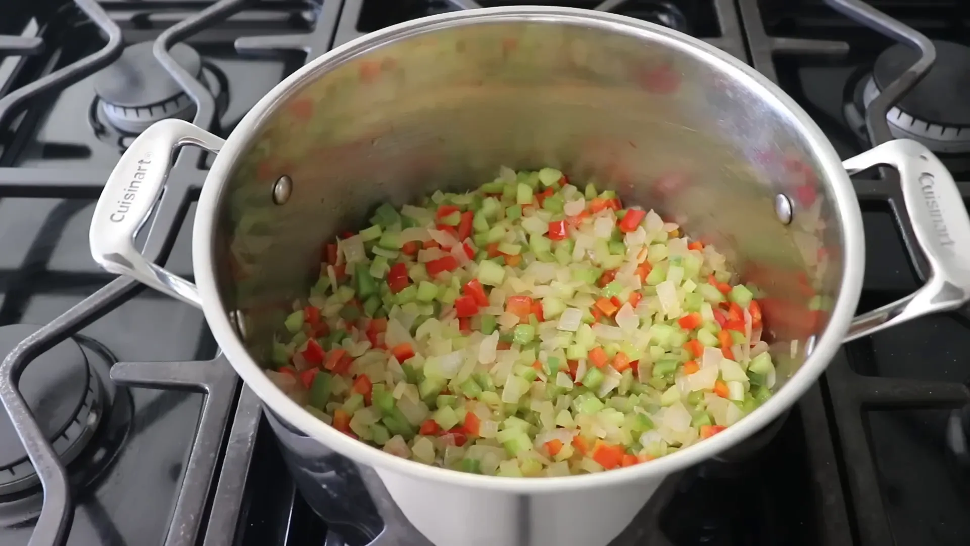 Onions and olive oil sizzling in a pot