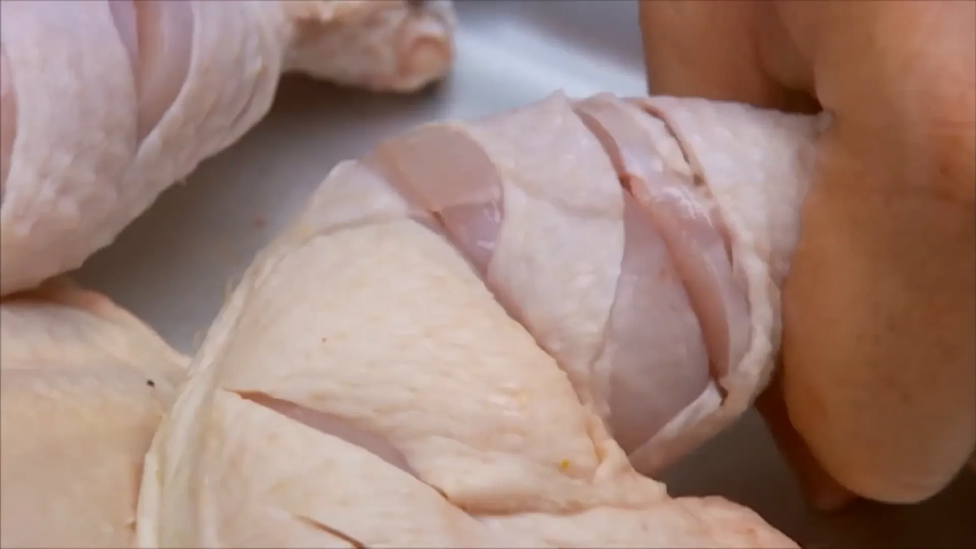 Rubbing BBQ spice mix onto chicken