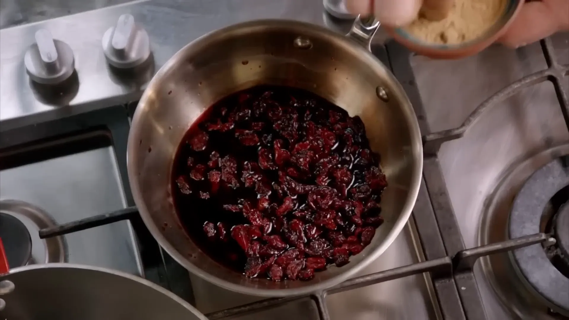 Simmering cranberries with port and spices