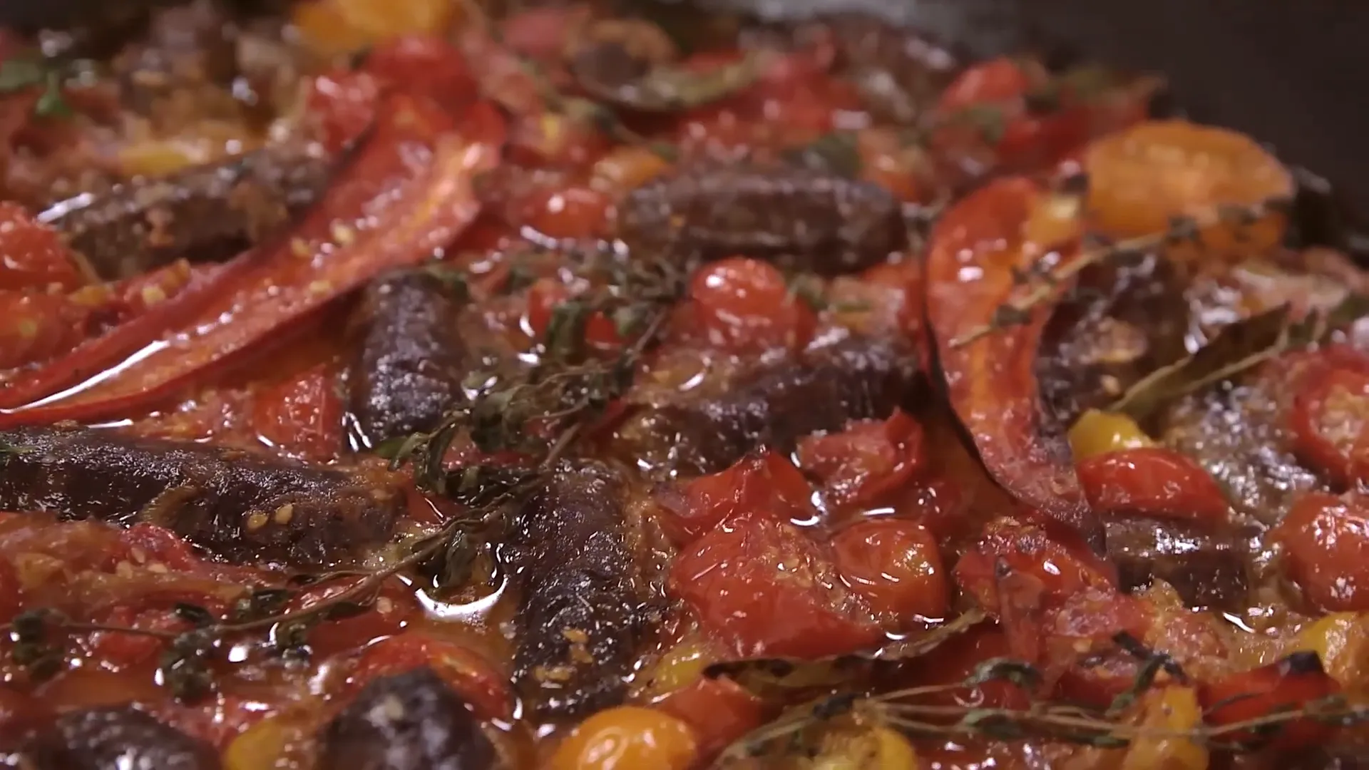 Spicy sausage pasta with cherry tomatoes and herbs