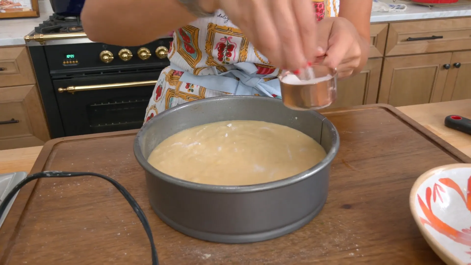 Sprinkling sugar on top of cake batter before baking