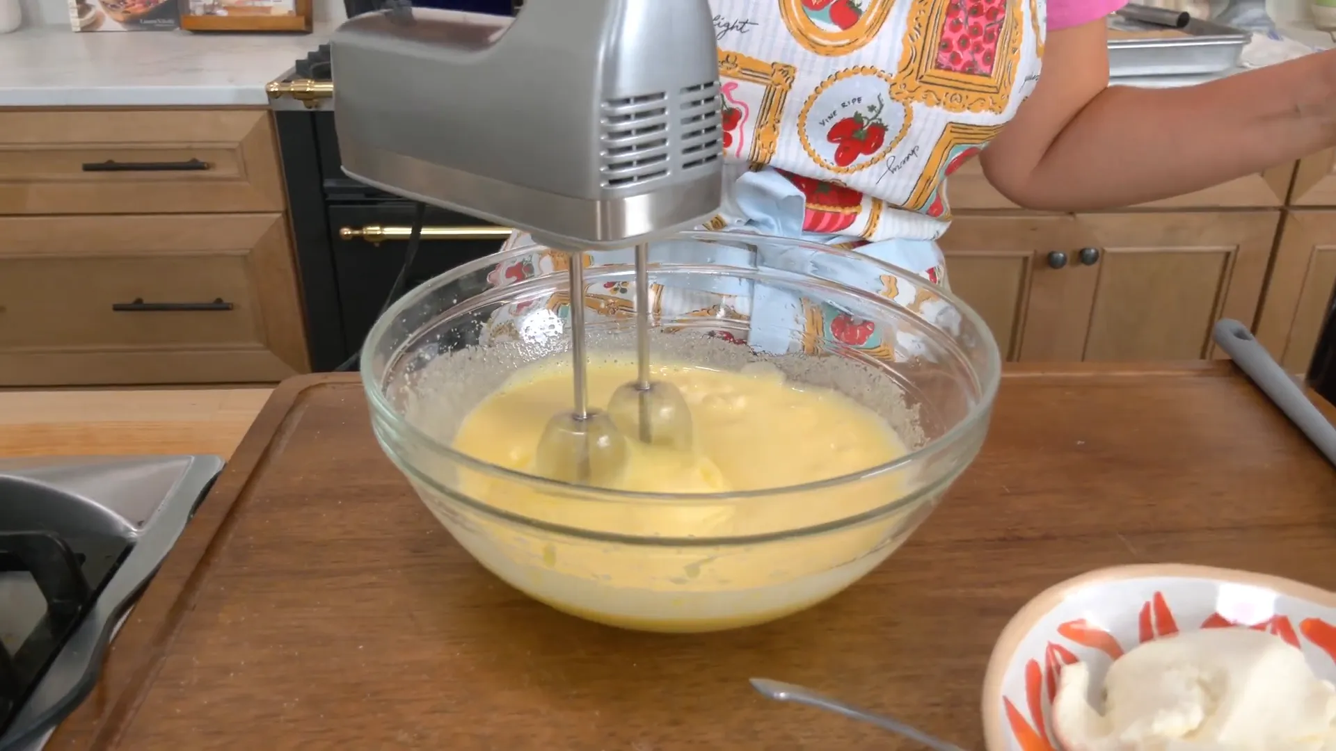 Whisking eggs and sugar until pale and fluffy