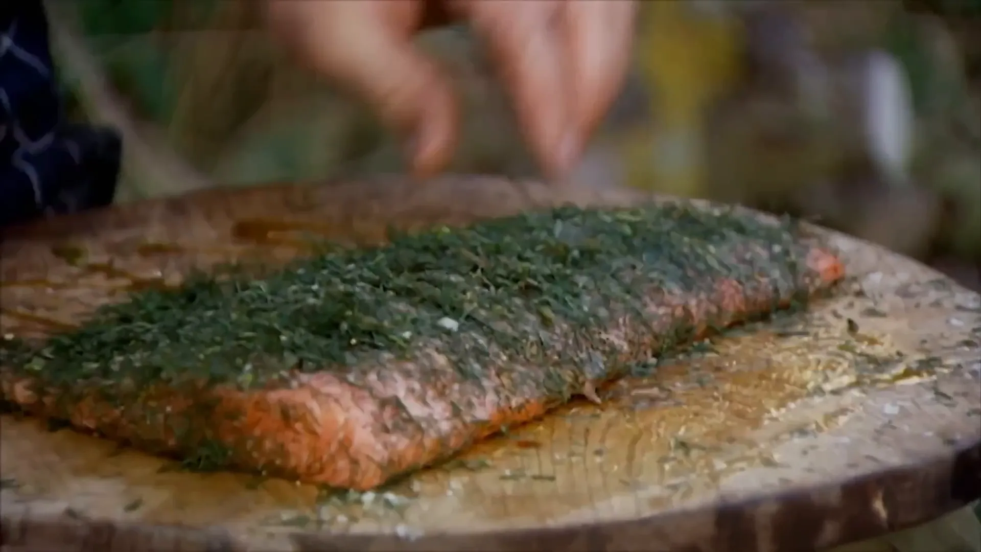 Oiling and salting the salmon skin for crispiness