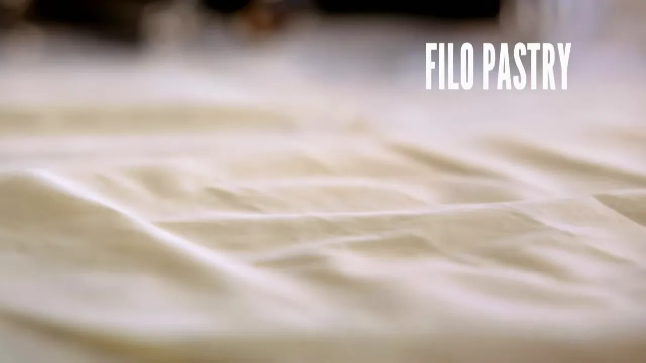 Thin filo pastry sheets on a work surface with 'FILO PASTRY' text overlay