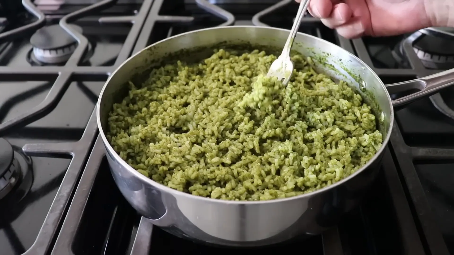 Fluffed green swamp rice showing separated grains