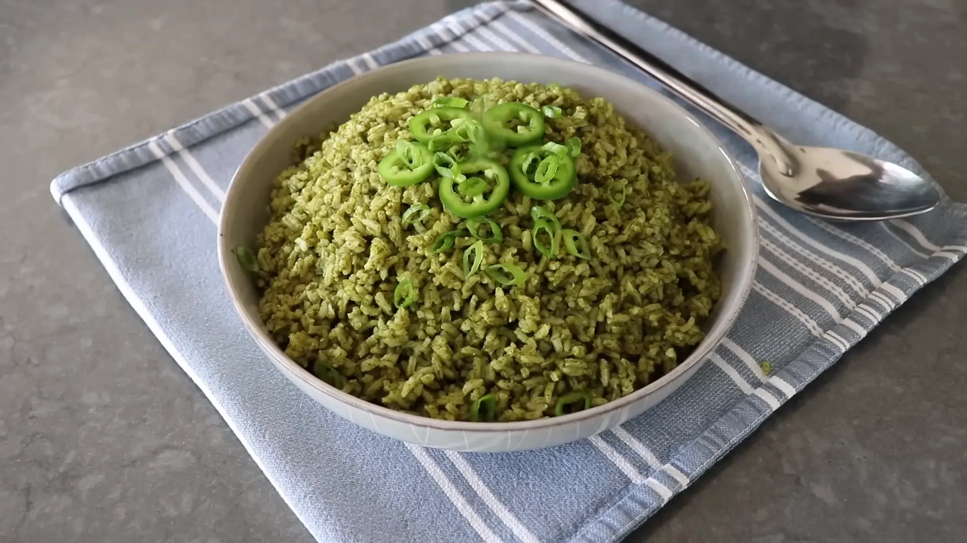 Swamp rice garnished with jalapeno rings and green onions