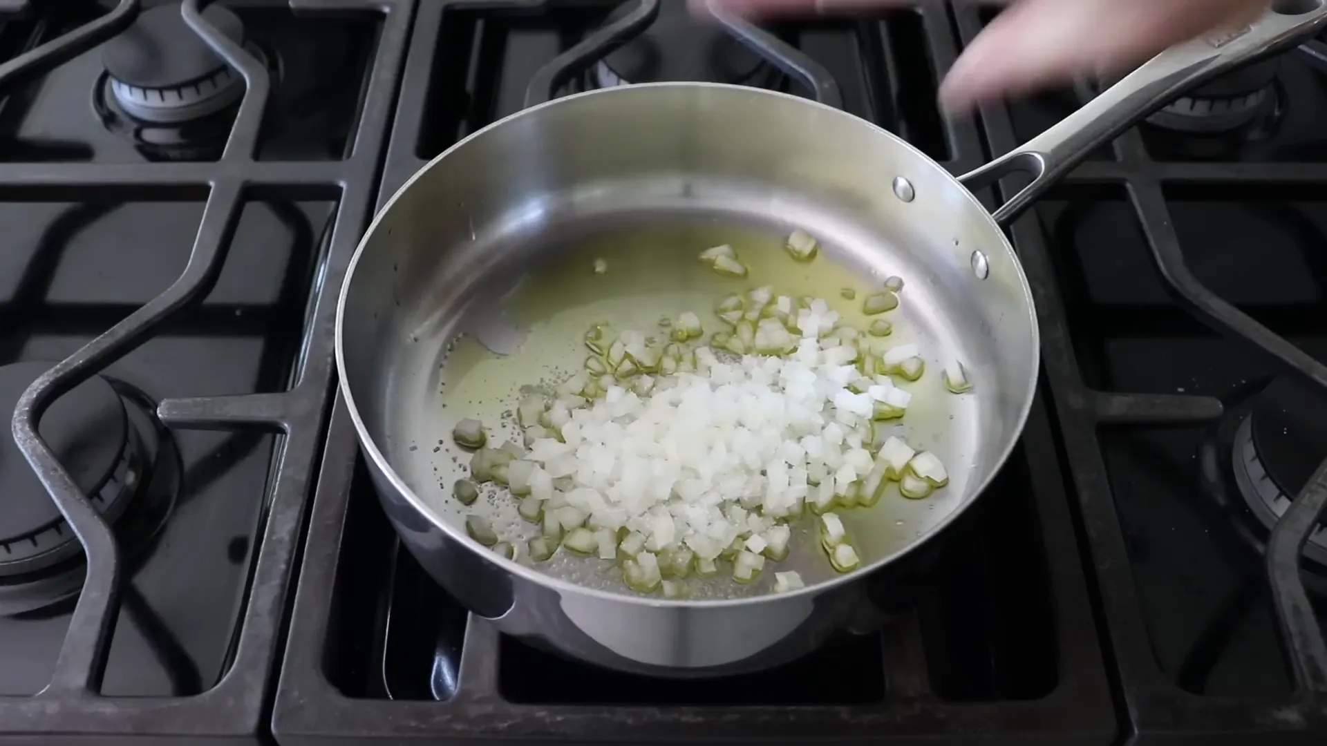 Diced onion sizzling in olive oil