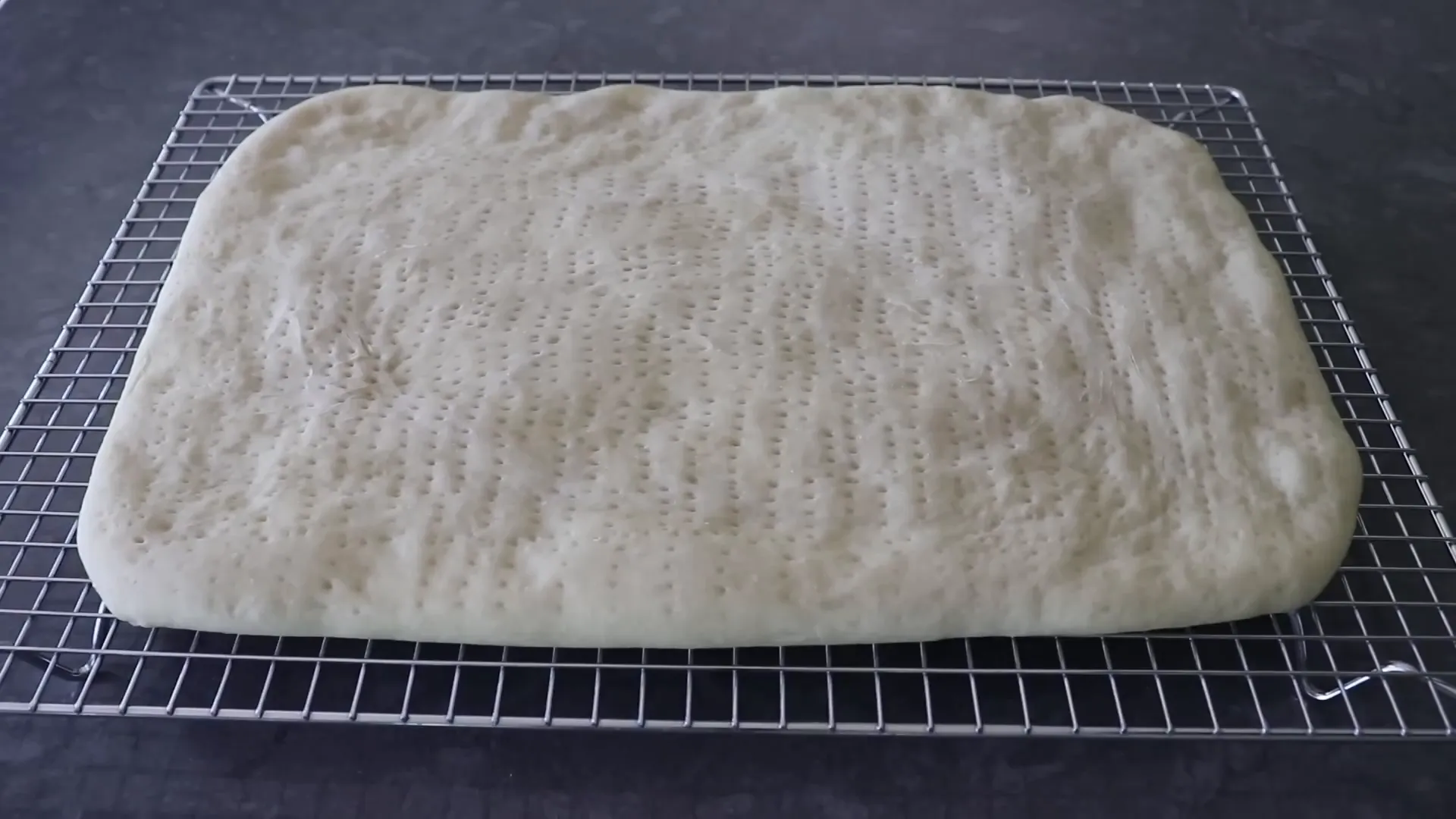 Prebaked pizza crust lightly golden and ready for toppings