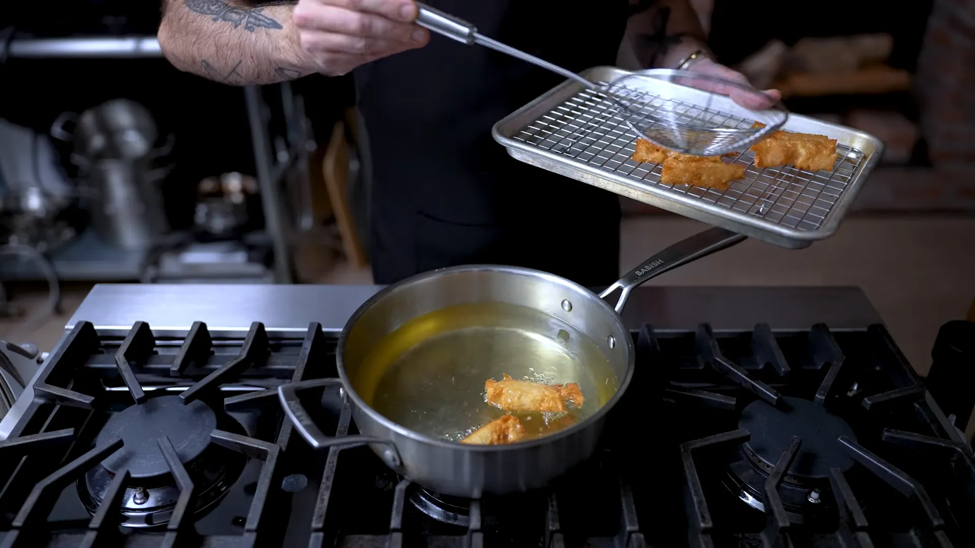 Deep-fried thick toast soldiers on a wire rack