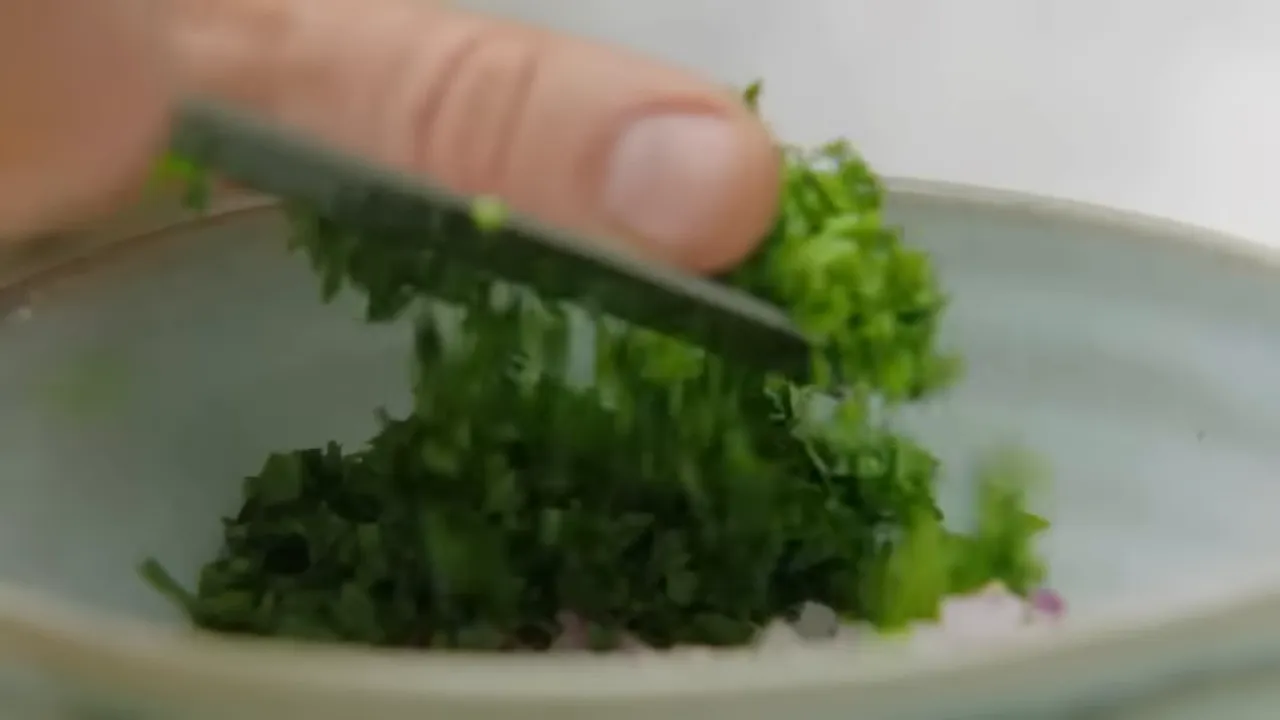 colorful tomato and coriander salsa being mixed