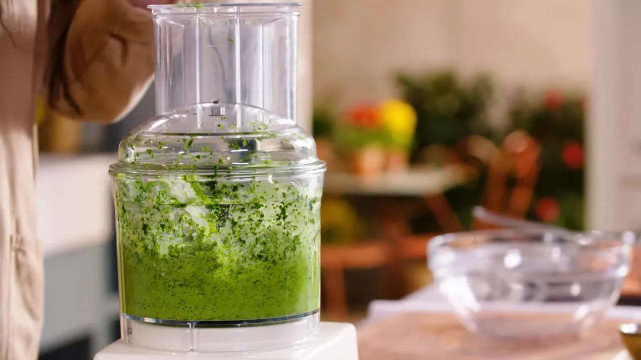smooth bright green wild garlic butter in a food processor bowl