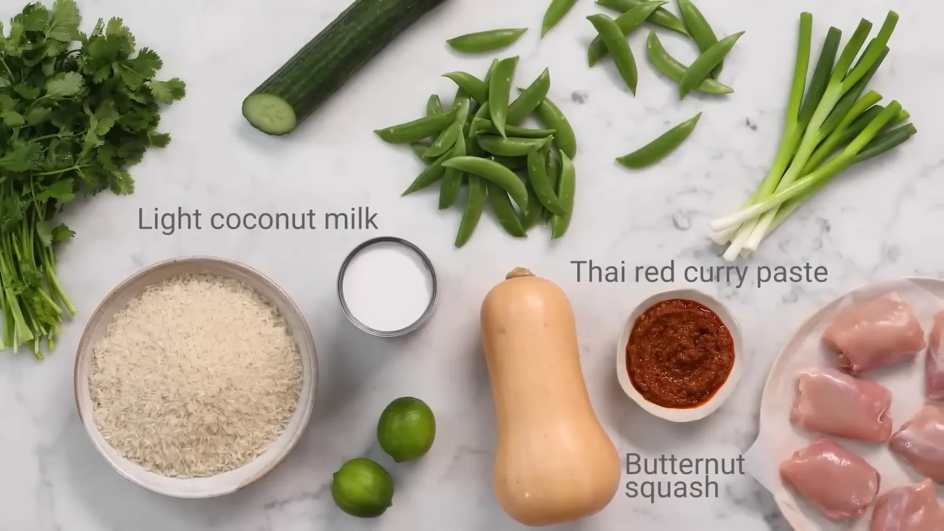 Traybake chicken with Thai red curry paste and squash in a roasting tray