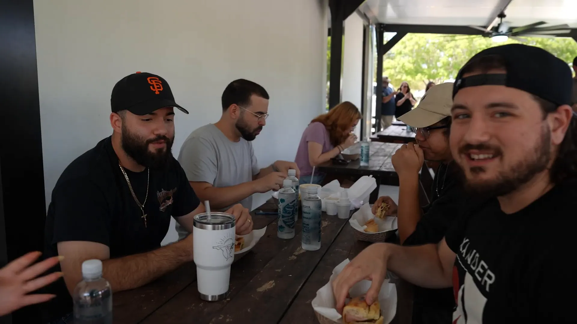 Fans enjoying the Cubano sandwiches from the food truck