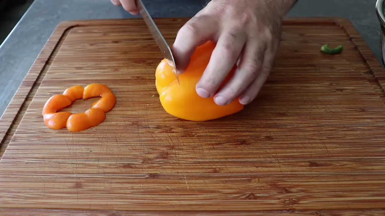 Cutting bell pepper into long seed-free strips