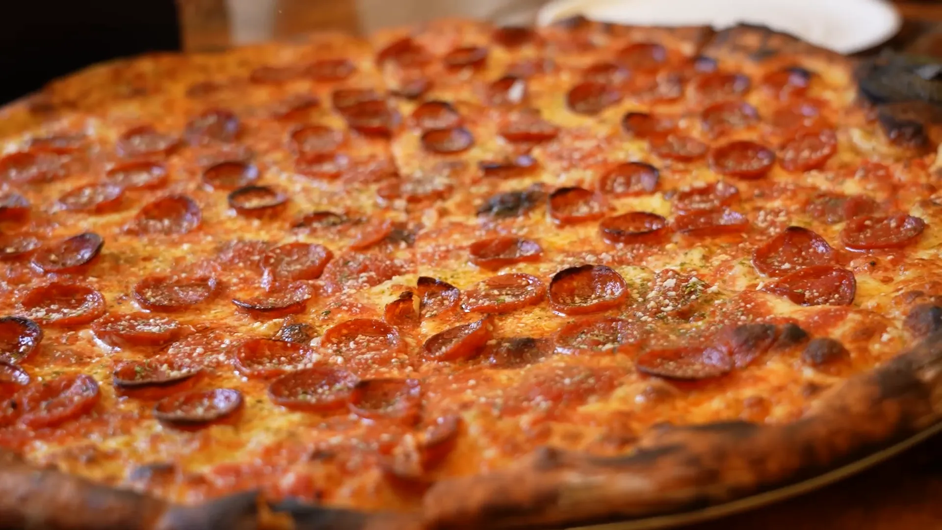 F & F oversized charred pizza slice with cupped pepperoni