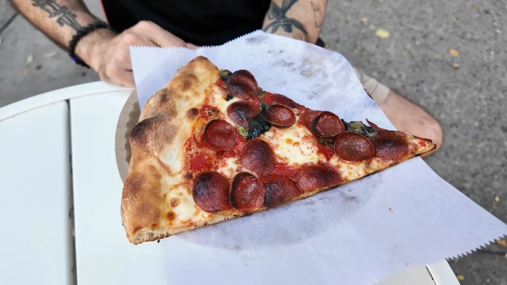 La Flor pizza slice with charred pepperoni and fresh basil